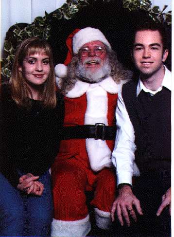Leah(left) and his friend(right) with Santa Clause(you guessed it, middle